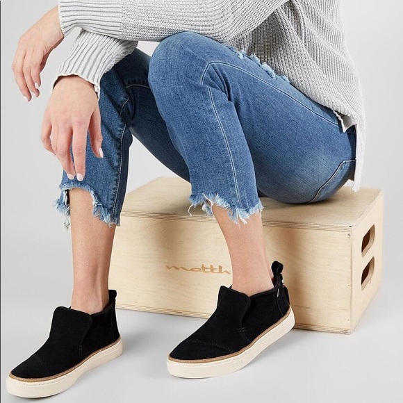 toms black leather slip ons